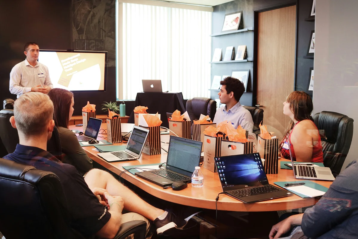 B2B marketing team reviewing paid ads performance in boardroom